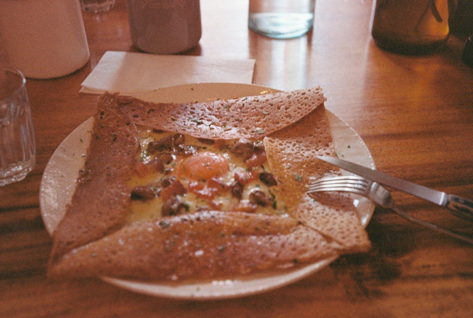 a plate of food on a wooden table