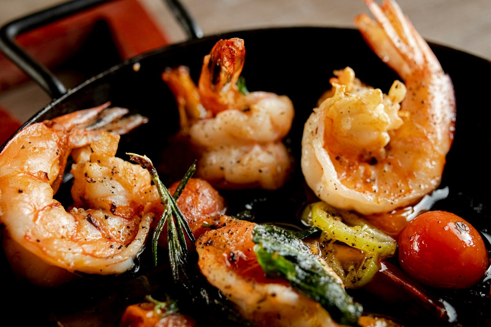 Cooked shrimp and vegetables in a pan