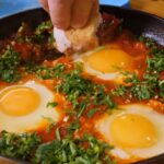 egg on black ceramic plate