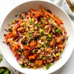 Asian chicken crunch salad in a bowl with creamy peanut dressing