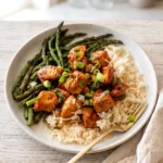 Honey mustard chicken bowls with jasmine rice, roasted asparagus, and sliced green onions