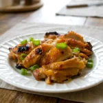 Vietnamese lemongrass chicken thighs served on a plate with browned, crisp edges
