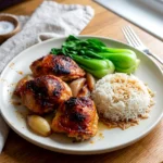 Garlic miso chicken thighs with roasted shallots served over rice and bok choy