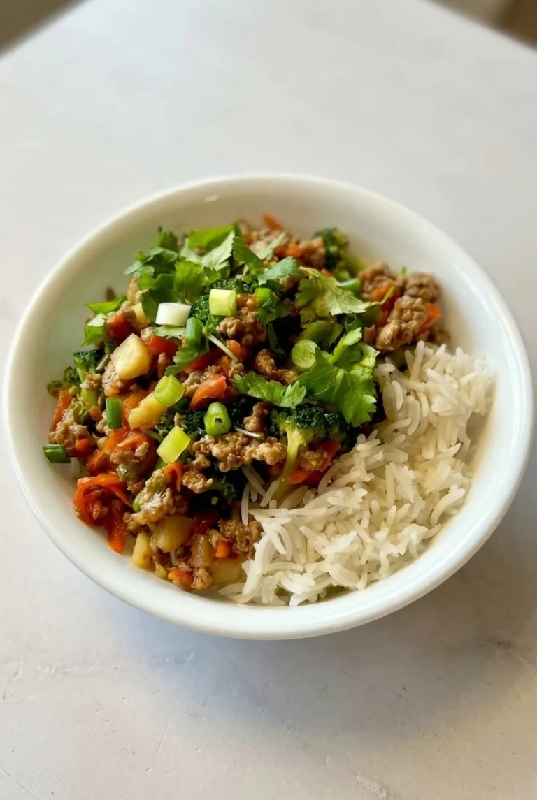 Ground turkey teriyaki rice bowl with separate white rice, vegetables, pineapple, cilantro, and green onion