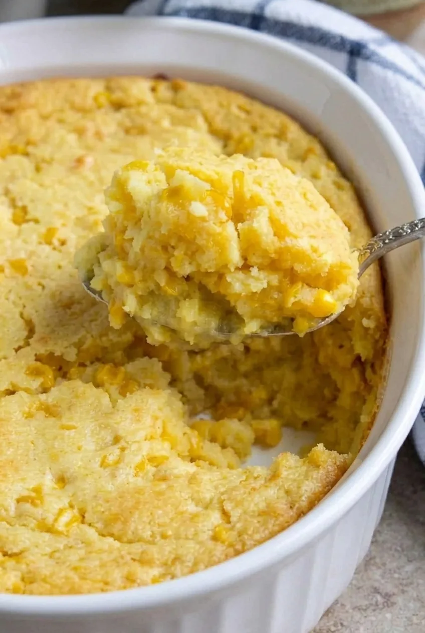 Close view of the moist, tender corn soufflé interior with visible kernels